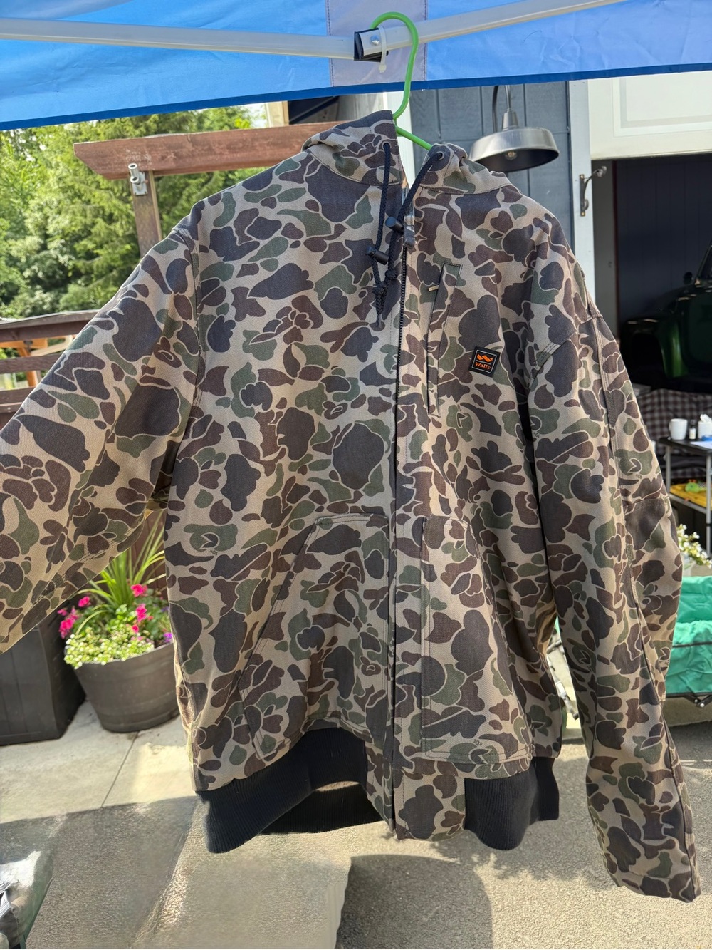 Walls Camouflage Jacket with Orange Logo Accents and hood.